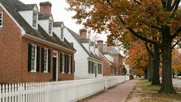 A historic colonial brick street in Virginia in autumn